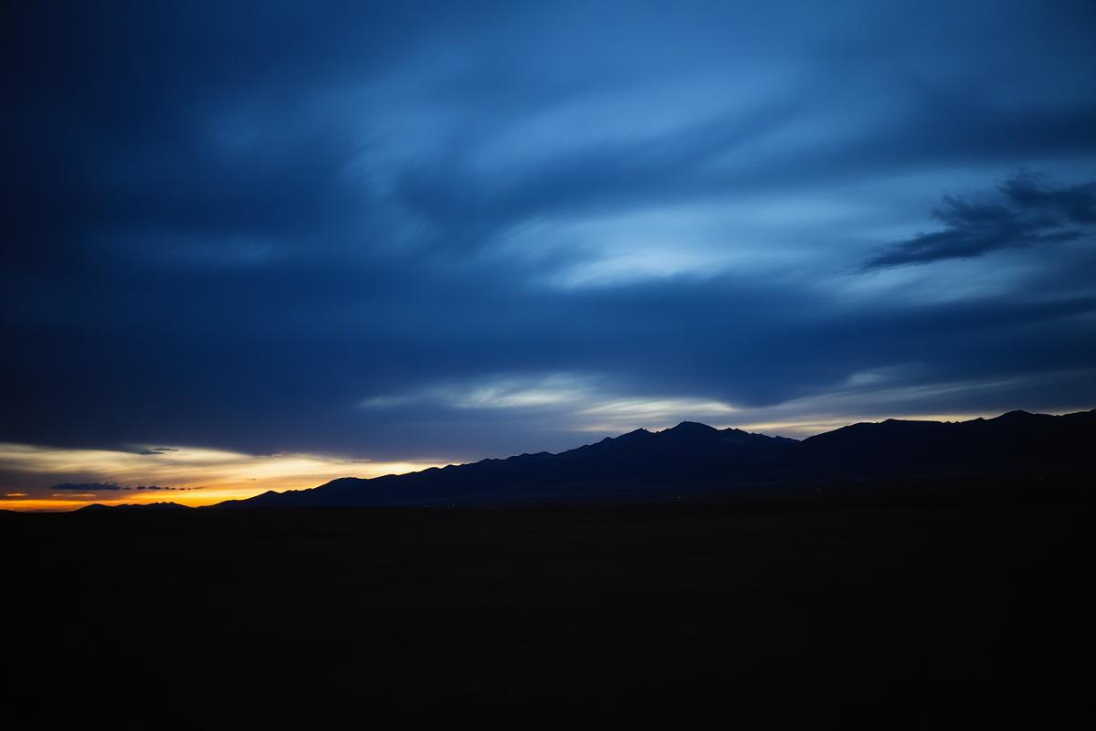 Placeholder silhouette of Alberta prairie and Rocky Mountains at dusk